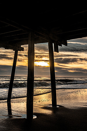 Golden Rays Under the Pier