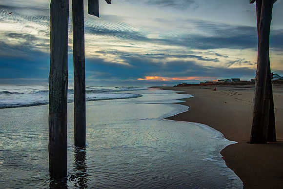 Dawn's Embrace: Between Pier Posts