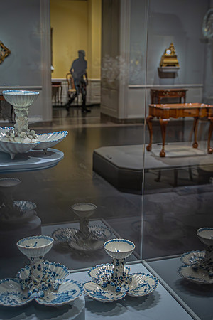 Delicate porcelain pieces with intricate designs on display at the National Gallery, symbolizing historical elegance and artistry.
