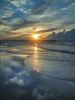 Pier Silhouetted at Sunrise