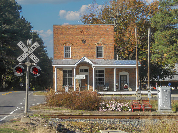 Historic Railroad Crossing and Brick Building
